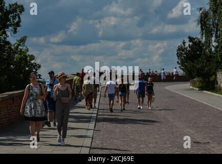 Visitors seen near the iconic Wawel Castle in Krakow's Old Town. On Tuesday, August 3, 2021, in Krakow, Lesser Poland Voivodeship, Poland. (Photo by Artur Widak/NurPhoto) Stock Photo