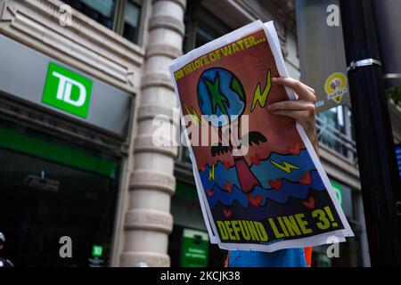 Demonstrators with the organization Climate First! protest outside of several branches of major banks on August 13, 2021 in Washington, D.C., USA. The protestors demanded the banks end their financing of the Line 3 oil pipeline, which they say is contributing to the climate change crisis. (Photo by Bryan Olin Dozier/NurPhoto) Stock Photo