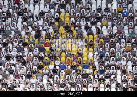 Juventus fans maintaining social distancing attend the pre-season friendly match between Juventus and Atalanta BC at Allianz Stadium on August 14, 2021 in Turin, Italy. (Photo by Giuseppe Cottini/NurPhoto) Stock Photo