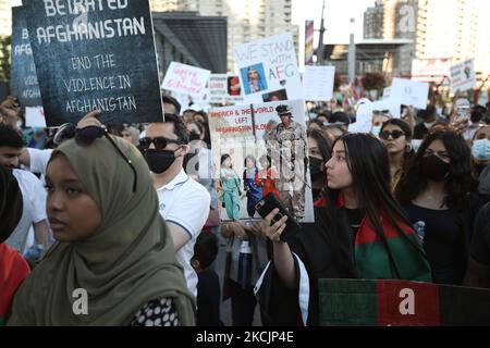 Dozens of Afghan gathered for a rally in solidarity with their countrymen on Sunday, on August 15, 2021 to condemn the actions of the Taliban, who have taken control of Afghanistan. Waving Afghan flags and holding up signs that read 'Save Afghanistan,' 'Help My Friend & Family #Afghanistan,' and 'Stop War in Afghanistan,' hundreds showed up at Celebration Square to denounce the takeover and call on the international community to do more to help Afghanistan. (Photo by Sayed Najafizada/NurPhoto) Stock Photo