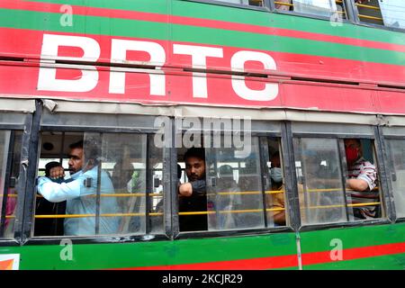 Passenger makes their travels in a Bus during Covid-19 Coronavirus pandemic in Dhaka, Bangladesh, on August 16, 2021. (Photo by Mamunur Rashid/NurPhoto) Stock Photo