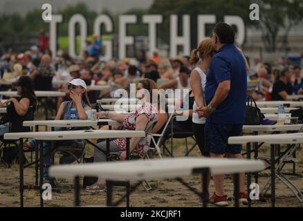 A couple enjoys a dance at Edmonton Rock Fest, a part of the Together Again series at the historic Racetrack Infield on the Edmonton Exhibition Lands (formerly Northlands Park) in Edmonton. On Saturday, 14 August 2021, in Edmonton, Alberta, Canada. (Photo by Artur Widak/NurPhoto) Stock Photo