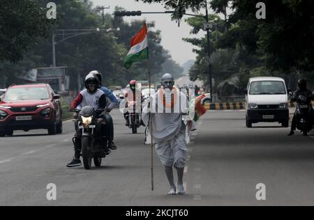 A man dressed as like as father of nation mahatma Gandhi as he is seen on the road and returns back home after attaining the 75th Independence Day celebration event in the eastern Indian state Odisha's capital city Bhubaneswar on August, 15, 2021. (Photo by STR/NurPhoto) Stock Photo