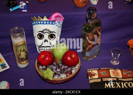 Decorated skull amongst offerings during the Day of the Dead celebrations in Toronto, Ontario, Canada, on November 07, 2015. The Day of the Dead (Dia de los Muertos) is a traditional Mexican holiday which coincides with All Souls Day in the Catholic calendar, is marked by visits to the grave sites of loved ones. It is a joyous occasion during which the celebrants remember the deceased. (Photo by Creative Touch Imaging Ltd./NurPhoto) Stock Photo