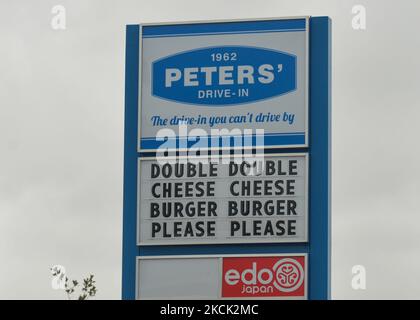 Sign that reads 'Double Double Cheese Cheese Burger Burger Please Please' seen outside Peters' Drive-In on Calgary Trail, in Edmonton. On Sunday, 21 August 2021, in Edmonton, Alberta, Canada. (Photo by Artur Widak/NurPhoto) Stock Photo