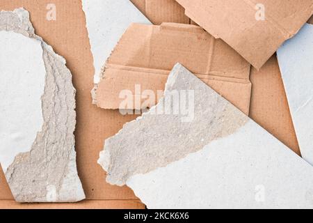 Close up top view of different sized cardboard papers with torn edge Stock Photo