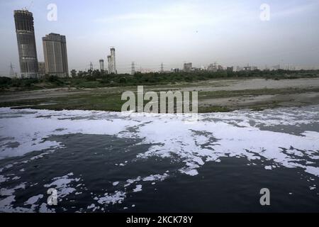 A general view shows the polluted water of Yamuna river covered with toxic foam in New Delhi, India on August 26, 2021. (Photo by Mayank Makhija/NurPhoto) Stock Photo