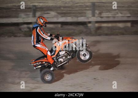 Quad racer performs a stunt during a motocross show in Toronto, Ontario, Canada, on October 02, 2010. (Photo by Creative Touch Imaging Ltd./NurPhoto) Stock Photo