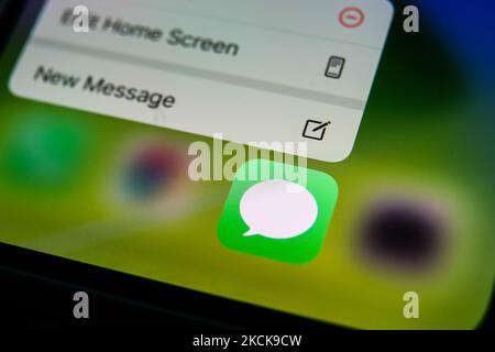Apple's Messages icon displayed on a phone screen is seen in this illustration photo taken in Krakow, Poland on August 26, 2021. (Photo Illustration by Jakub Porzycki/NurPhoto) Stock Photo