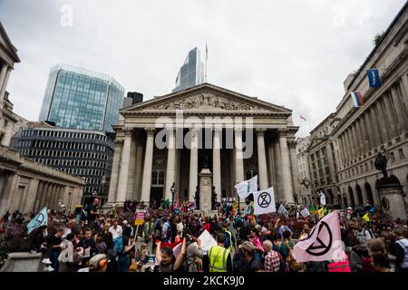 Climate activists from Extinction Rebellion gather during their 'Blood Money March' protest as part of their Impossible Rebellion campaign, outside the Bank of England in London, Britain, 27 August 2021. Climate action group Extinction Rebellion (XR) are planning to hold multiple actions over two weeks from August 23rd 2021 aiming to disrupt the City of London and further afield and put climate change at the top of the agenda ahead of the UK hosting COP26 Summit later this year. (Photo by Maciek Musialek/NurPhoto) Stock Photo