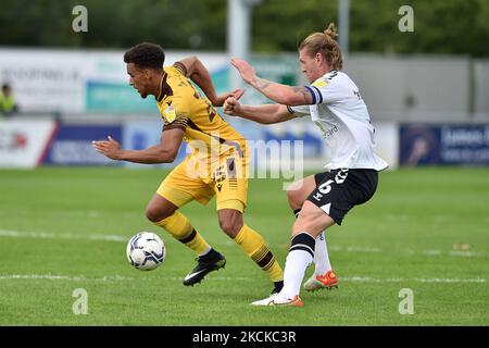 Oldham Athletic's Carl Piergianni tussles with Donovan Wilson of Sutton United during the Sky Bet League 2 match between Sutton United and Oldham Athletic at the Knights Community Stadium, Gander Green Lane,, Sutton on Saturday 28th August 2021. (Photo by Eddie Garvey/MI News/NurPhoto) Stock Photo