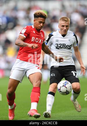 Jordan Gabriel of Nottingham Forest battles with Louie Sibley of Derby County during the Sky Bet Championship match between Derby County and Nottingham Forest at the Pride Park, Derby on Saturday 28th August 2021. (Photo by Jon Hobley/MI News/NurPhoto) Stock Photo