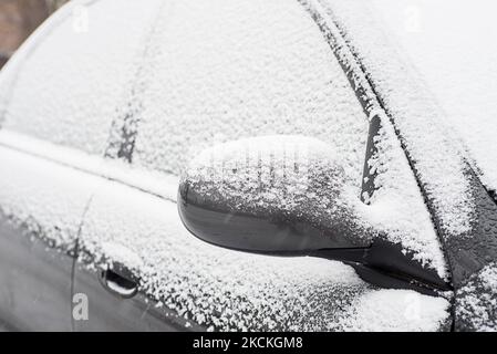 Car covered with fresh white snow on a winter day. Vehicle covered with snow Stock Photo