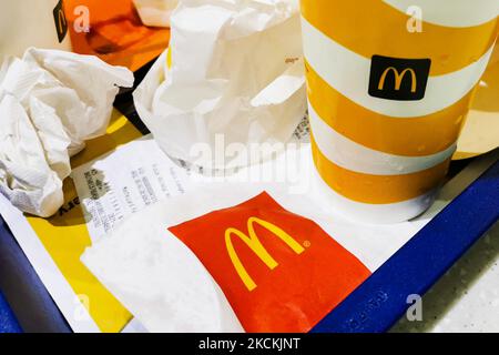 The remains of McDonald's meal are seen next to McDonald's restaurant in Krakow, Poland on August 30, 2021 (Photo by Beata Zawrzel/NurPhoto) Stock Photo