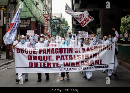 Filipino health workers calling for the release of the benefits and ...