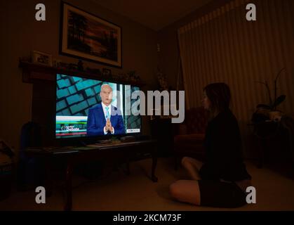 A woman watches Conservative Party of Canada Leader Erin O’Toole speaking during the official televised Federal election leaders' debate at her home in Edmonton. Five federal leaders take part in the English-language debate with Bloc Québécois Leader Yves-François Blanchet, Conservative Party of Canada Leader Erin O’Toole, Green Party of Canada Leader Annamie Paul, Liberal Party of Canada Leader Justin Trudeau and New Democratic Party Leader Jagmeet Singh. On Thursday, 9 September 2021, in Edmonton, Alberta, Canada. (Photo by Artur Widak/NurPhoto) Stock Photo
