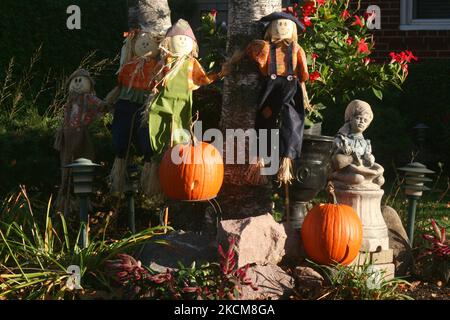 Scarecrows and pumpkins on display outside a home during the Autumn season in Maple, Ontario, Canada. (Photo by Creative Touch Imaging Ltd./NurPhoto) Stock Photo