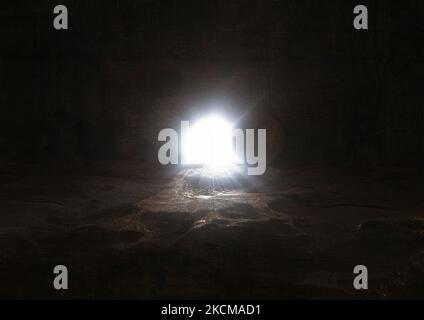 The death and resurrection of Jesus Christ and the opening of the tomb door and a bright light coming out Stock Photo
