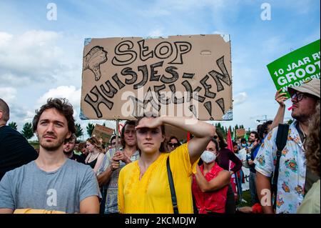 Two persons are holding a placard against the expensive rents for students, during the demonstration for the right to decent housing organized, in Amsterdam, on September 12th, 2021. (Photo by Romy Arroyo Fernandez/NurPhoto) Stock Photo