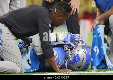 Detroit Lions defensive tackle Kevin Strong (92) is checked by