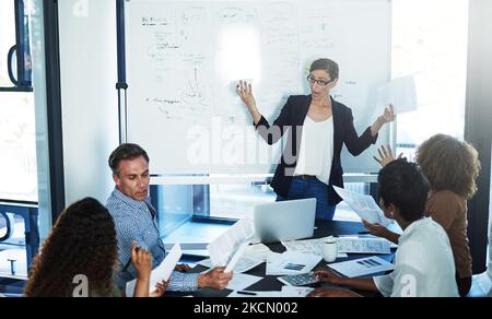 Why is no one prepared for this meeting. a stressed businesswoman losing her temper during a meeting with her colleagues in the boardroom. Stock Photo