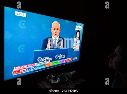 A woman watches Conservative Party of Canada leader Erin O'Toole speaking during a televised address on election night on CTV News. Early election results predict Liberal leader Justin Trudeau to win enough seats in this 44th general election to form another minority government On Monday, September 20, 2021, in Edmonton, Alberta, Canada. (Photo by Artur Widak/NurPhoto) Stock Photo