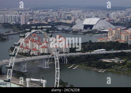 A general view of the Singapore Flyer, National Stadium and the residential housing estates on September 21, 2021 in Singapore. (Photo by Suhaimi Abdullah/NurPhoto) Stock Photo