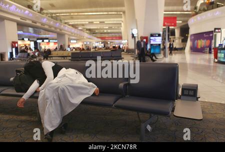 Muslim girl takes a nap at around 3AM while waiting for an early morning flight to Kabul from Delhi in terminal 3 at Indira Gandhi International Airport in Delhi, India, on December 04, 2011. (Photo by Creative Touch Imaging Ltd./NurPhoto) Stock Photo