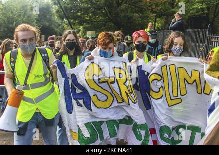 Protesters take part in a climate protest as they march though the city centre on September 24, 2021 in Glasgow, Scotland. Thousands of people across the world are taking part in the Global Youth Strike For Climate in the lead up to COP26 climate summit which is due to be hosted in Glasgow. (Photo by Ewan Bootman/NurPhoto) Stock Photo