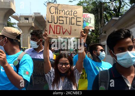 Climate activists and supporters display placards during a global climate strike, part of the Fridays for Future, in Dhaka, Bangladesh, on September 24, 2021. (Photo by Mamunur Rashid/NurPhoto) Stock Photo