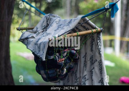 Members of the Embera Katio Indigenous community camp at Colombia's National Park in Bogota, Colombia after violence and criminality got them out of their territories in early 2020. On October 3, 2021 in Bogota, Colombia. (Photo by Sebastian Barros/NurPhoto) Stock Photo