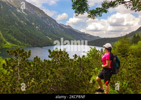 View of the mountain lake Morskie Oko surrounded by Tatra mountain peaks in Poland Stock Photo