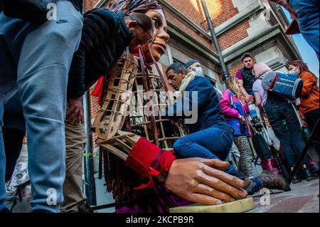 A giant puppet is currently grabbing attention across Europe to the plight of young refugees who have fled from Syria. Little Amal represents a nine-year-old Syrian refugee girl and is over 11-feet-tall. She has been walking nearly 8,000 km from the Syrian-Turkish border looking for her mother and it will end in November in Manchester. This weekend, Amal, which means “hope” in Arabic, was warmly welcomed by children, musicians, and other giants to the Borgerhout district known for its cultural diversity, on October 9th, 2021. (Photo by Romy Arroyo Fernandez/NurPhoto) Stock Photo