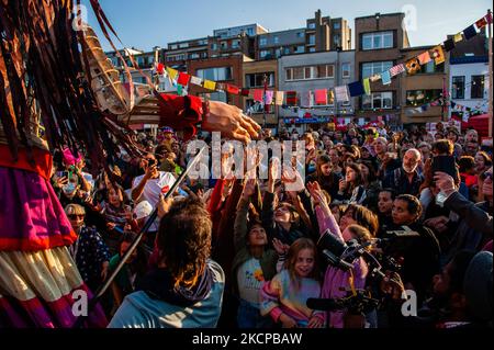 A giant puppet is currently grabbing attention across Europe to the plight of young refugees who have fled from Syria. Little Amal represents a nine-year-old Syrian refugee girl and is over 11-feet-tall. She has been walking nearly 8,000 km from the Syrian-Turkish border looking for her mother and it will end in November in Manchester. This weekend, Amal, which means “hope” in Arabic, was warmly welcomed by children, musicians, and other giants to the Borgerhout district known for its cultural diversity, on October 9th, 2021. (Photo by Romy Arroyo Fernandez/NurPhoto) Stock Photo