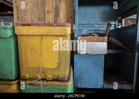 Fish market at the Muara Angke market, in Jakarta, Indonesia, on October 14, 2021. Since the Covid-19 pandemic, fish sales in Muara Angke have decreased drastically. (Photo by Donal Husni/NurPhoto) Stock Photo