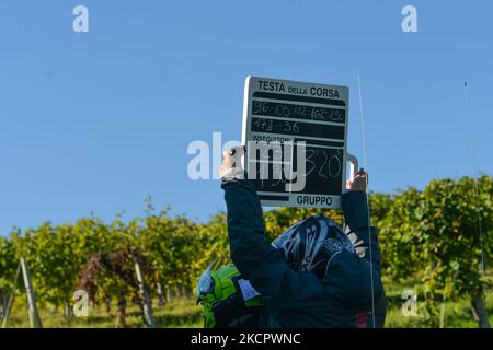 A timekeeper with a times board durin g the first edition of the Veneto Classic, the 207km pro cycling race from Venezia to Bassano del Grappa, held in the Veneto region. On Sunday, October 17, 2021, in Bassano del Grappa, Veneto, Italy. (Photo by Artur Widak/NurPhoto) Stock Photo