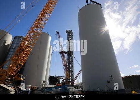 The nearly finished Starship launch tower is seen behind the tank farm on October 19th, 2021. (Photo by Reginald Mathalone/NurPhoto) Stock Photo