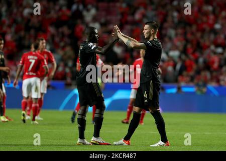 Niklas Sule of Bayern Muenchen (R ) celebrates with Dayot Upamecano during the UEFA Champions League group E football match between SL Benfica and FC Bayern Muenchen at the Luz stadium in Lisbon, Portugal on October 20, 2021. (Photo by Pedro FiÃºza/NurPhoto) Stock Photo