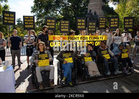 People attend a youth-led hunger strike and climate change rally near the White House on October 22, 2021. The five youth were on day three of a hunger strike to bring attention to the climate crisis and call on the government for change. (Photo by Bryan Olin Dozier/NurPhoto) Stock Photo
