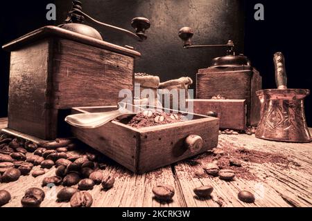 Milled coffee beans in bag and grinder with ground coffee Stock Photo