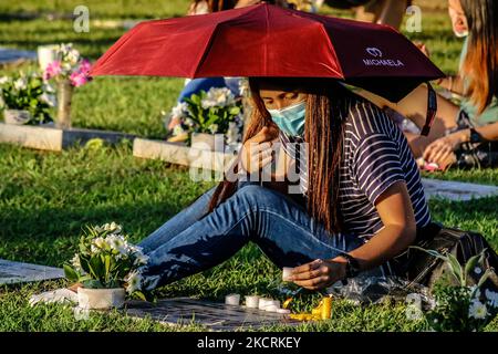 Residents of Antipolo City, Philippines visit the tomb of their loved ones inside cemeteries on October 27, 2021. Since the pandemic hit the Philippines on March 2020, public and private cemeteries in the country are still closing their doors for visitors this coming October 29 until November 2 to avoid the massive spread of COVID-19 on the celebration of All Soul's Day. (Photo by Ryan Eduard Benaid/NurPhoto) Stock Photo