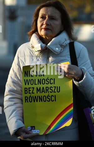 A woman holds a poster reading 'No freedom without equality marches' during a rally in front of parliament on 29 October, 2021 to protest against a law proposal that would ban equality marches. The bill, introduced by conservative, anti-abortion activist Kaja Godek has critics fearing that a law will be passed fully banning gay pride marches, known as equality marches in Poland. Poland has been named as the worst country for LGBT people to live in the EU with several regions having declared themselves 'free of LGBT ideology'. The anti-LGBT climate in the country has seen many LGBT people seek  Stock Photo