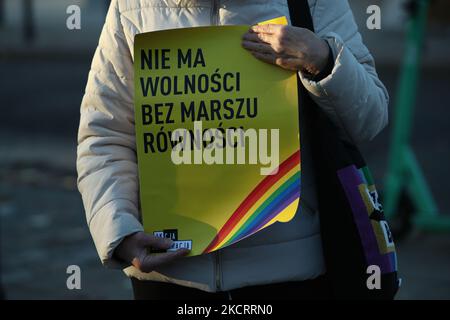 A woman holds a poster reading 'No freedom without equality marches' during a rally in front of parliament on 29 October, 2021 to protest against a law proposal that would ban equality marches. The bill, introduced by conservative, anti-abortion activist Kaja Godek has critics fearing that a law will be passed fully banning gay pride marches, known as equality marches in Poland. Poland has been named as the worst country for LGBT people to live in the EU with several regions having declared themselves 'free of LGBT ideology'. The anti-LGBT climate in the country has seen many LGBT people seek  Stock Photo