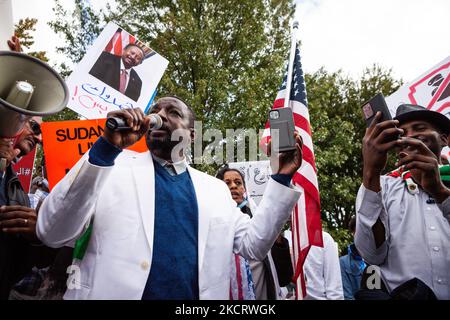 A demonstrator leads the crowds in chanting during a protest against the military coup in Sudan. Thousands of people from across the east coast of the US came to Washington to take part in the demonstration. (Photo by Allison Bailey/NurPhoto) Stock Photo