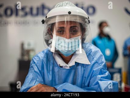 A vaccination team nurse poses for a portrait as the Colombian government begins to vaccinate children between ages 3 to 11 against the Coronavirus disease (COVID-19) with the China's SINOVAC vaccine, in Bogota, Colombia on October 31, 2021. (Photo by Sebastian Barros/NurPhoto) Stock Photo