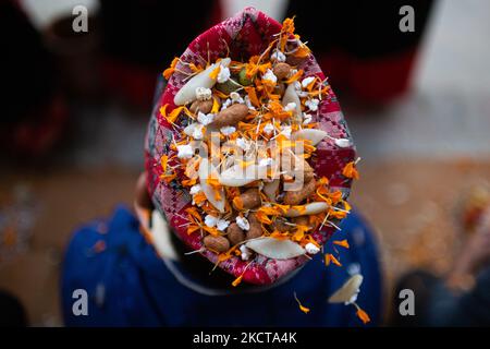 Nepalese people take part in a mass Mha: Pooja ceremony at Khokana, Lalitpur on Friday, November 5, 2021. Mha: Pooja meaning worshipping own bodies in local languages is observed on the fourth day of the Tihar festival especially by the Newar community. (Photo by Rojan Shrestha/NurPhoto) Stock Photo