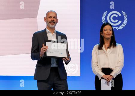 Representative of Microsoft receive an award in Climate Neutral Now category during UN Global Climate Action Awards ceremony in Action Hub in the COP26 venue - Scottish Event Campus during the eleventh day of the COP26 UN Climate Change Conference, held by UNFCCC in Glasgow, Scotland on November 10, 2021. COP26, running from October 31 to November to 12 in Glasgow, is the most significant climate conference since the 2015 Paris summit as the nations are expected to set new greenhouse gas emission targets in order to slow the global warming, as well as firming up other key commitments. (Photo b Stock Photo