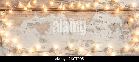 Old vintage white wooden plank with Christmas lights texture background Stock Photo