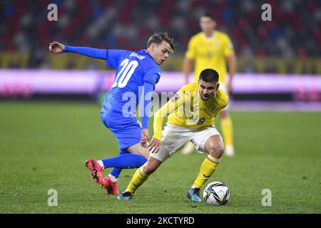 Razvan Marin and Thorir Johann Helgason in action during the FIFA World ...