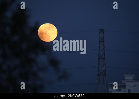 View of the moon during a partial lunar eclipse in Bangladesh, in Chittagong, Bangladesh, on November 19, 2021. (Photo by Zakir Hossain Chowdhury/NurPhoto) Stock Photo